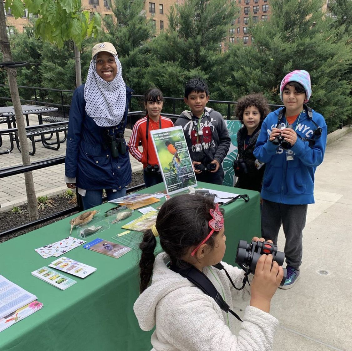 Children with binoculars at the LeFrak City gardens