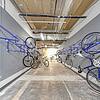 a group of bicycles in a storage room