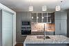 a kitchen with a marble countertop