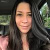 woman in car smiling