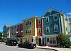 Exterior view of West Broadway Homes multi-color building
