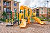 Playground equipment with buildings in background