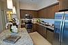 Apartment Kitchen with stainless steel appliances and island