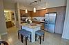 Apartment Kitchen with stainless steel appliances and island