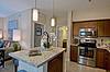 Apartment Kitchen with stainless steel appliances and island