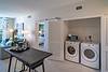Washer and Dryer station next to kitchen