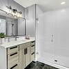 Bathroom with large vanity and Shower and tub combo