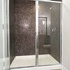 tiled shower and bath