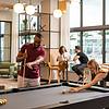 a group of people playing pool