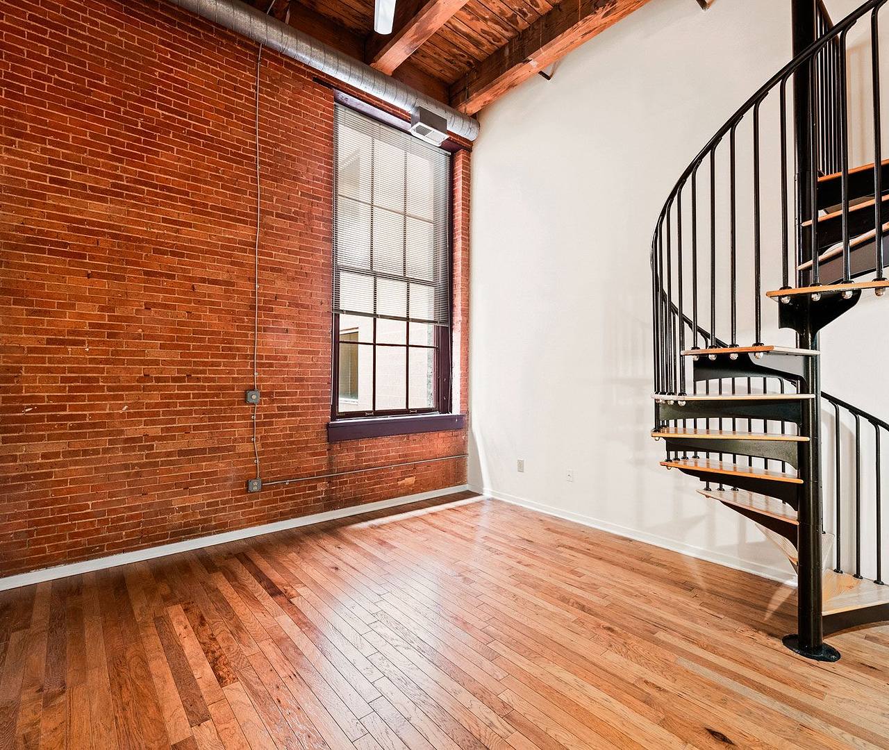 Apartment living area with spiral staircase