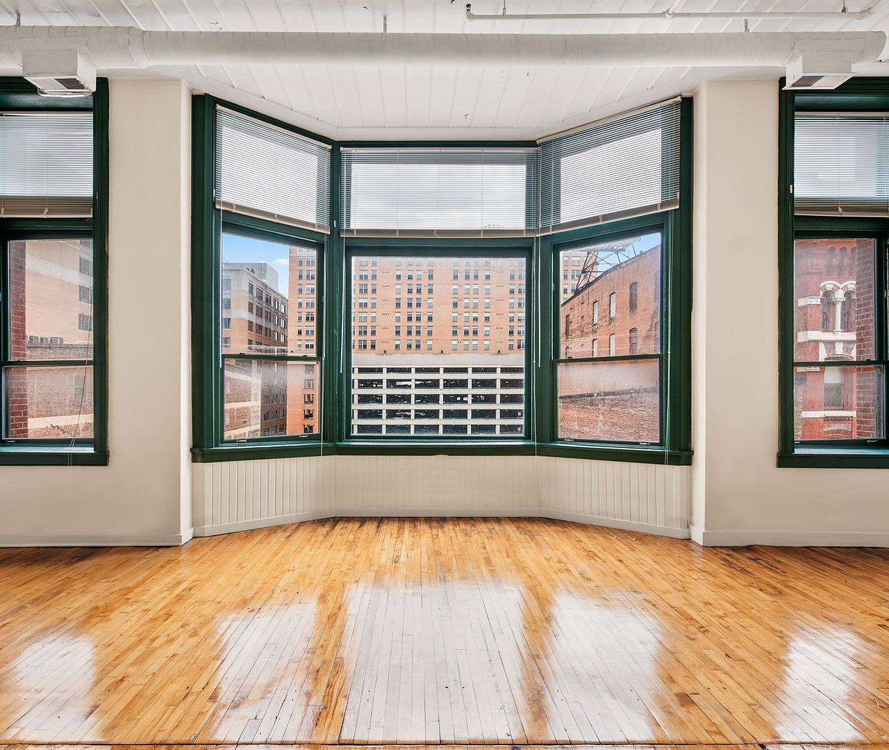 Unfurnished apartment living room with large windows