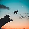 a paper airplane flying