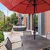 Open patio with umbrellas for shade and a sofa at Lantower Bullhouse.