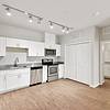 kitchen with hardwood floors, accessible cabinets and stainless steel appliances at Lantower Edgewater