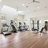 Spacious gym filled with gym equipment on hardwood floors at Lantower Edgewater