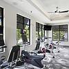 Fully equipped fitness center with free weights, cardio machines, and display monitors at Lantower Waverly Apartments.