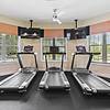 Fully Equipped Fitness Studio featuring Crossfit Box with large ceiling fans and large windows to let in natural light Resort-style pool with sundeck and lounge chairs at Lantower Asturia.