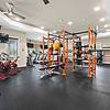 Fully Equipped Fitness Studio featuring Crossfit Box with large ceiling fans and large windows to let in natural light Resort-style pool with sundeck and lounge chairs at Lantower Asturia.