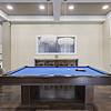 Game room with a billiard table and a seating area at Lantower Asturia Apartments.