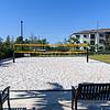 beach volleyball court with benches