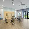 24-Hour Fitness Center with Yoga Room & Fitness On-Demand with wooden floors and floor-to-ceiling windows at Lantower Garrison Park.