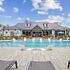 Large, resort-style pool with poolside cabanas, lounge seating, and a tanning ledge at Lantower Garrison Park.