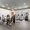 State-of-the-art fitness center at Lantower Tortuga Bay with cardio machines, weigh machines, and Stairmaster.