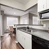 Spacious kitchen with black appliances and white cabinetry at Lantower Round Rock.