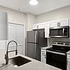 Kitchen with plank flooring and stainless steel appliances at Lantower Round Rock.