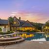 Swimming pool with a deck and ample seating at sunset hour at Lantower Round Rock..