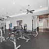 Spacious and clean 24-hour gym with weights, fitness machines, and a punching bag at Lantower Grande Pines.