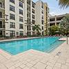 Resort-style swimming pool with sundeck, grills, and ample relaxing cabana seating at Lantower Westshore.