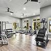 gym with free weights and machines, treadmills, stair steppers, and ellipticals all with a pool view at Lantower Techridge apartments
