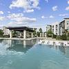 Resort-style swimming pool with a deck and seating at Lantower Techridge apartments