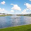 Spacious lake with water fountain surrounded by townhome rentals