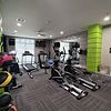 Fitness Room with cardio equipment and free weights.
