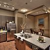 Apartment kitchen with island and stainless steel appliances