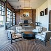Lounge space with billiards, TVs and garage-door style window wall