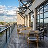Outdoor lounge space overlooking ONEOK Field