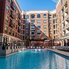 Resort style swimming pool with sun deck and fountains