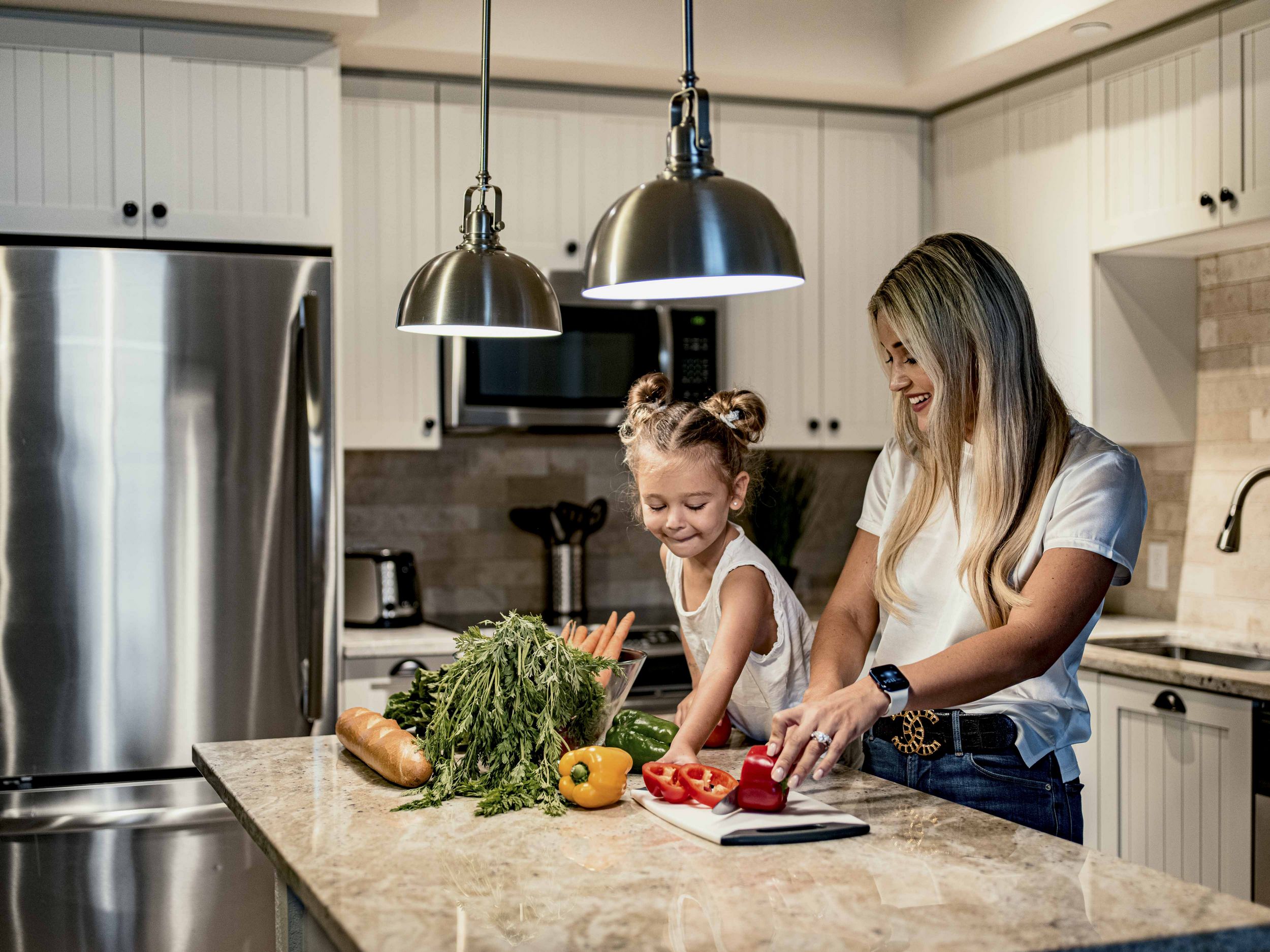 Woman and child cooking on counter