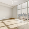 Unfurnished room with large windows