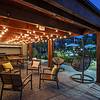 Outdoor lounge area with seating and string lights