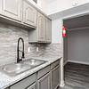 kitchen with a gooseneck faucet and double stainless sink