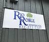 sign on wall for Rio Roble Apartments