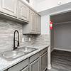 kitchen at Allendale with gray and white countertop and tile backsplash