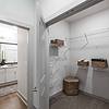 Closet with view of bathroom