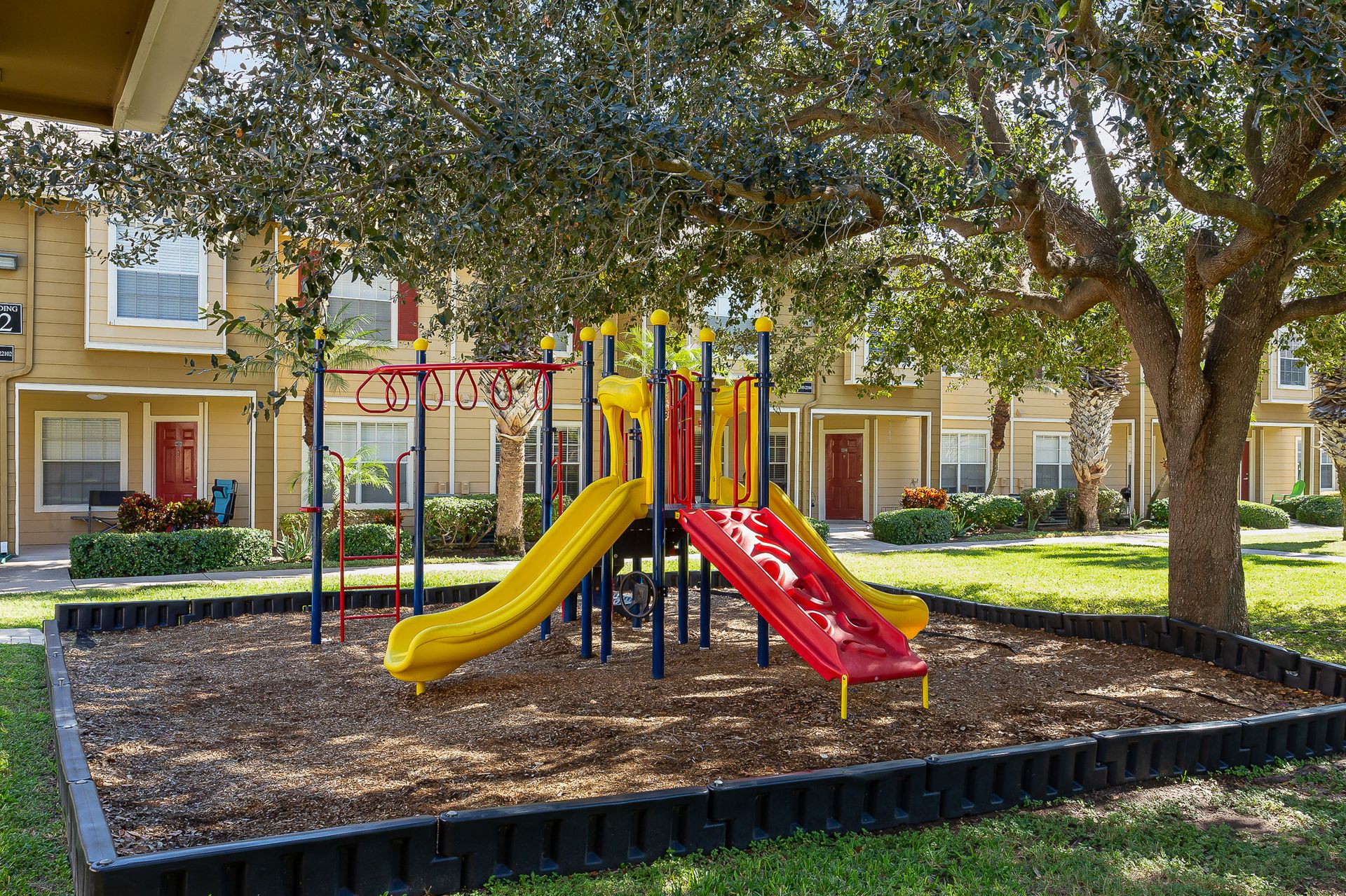 Playcenter and play area in front of apartment buildings