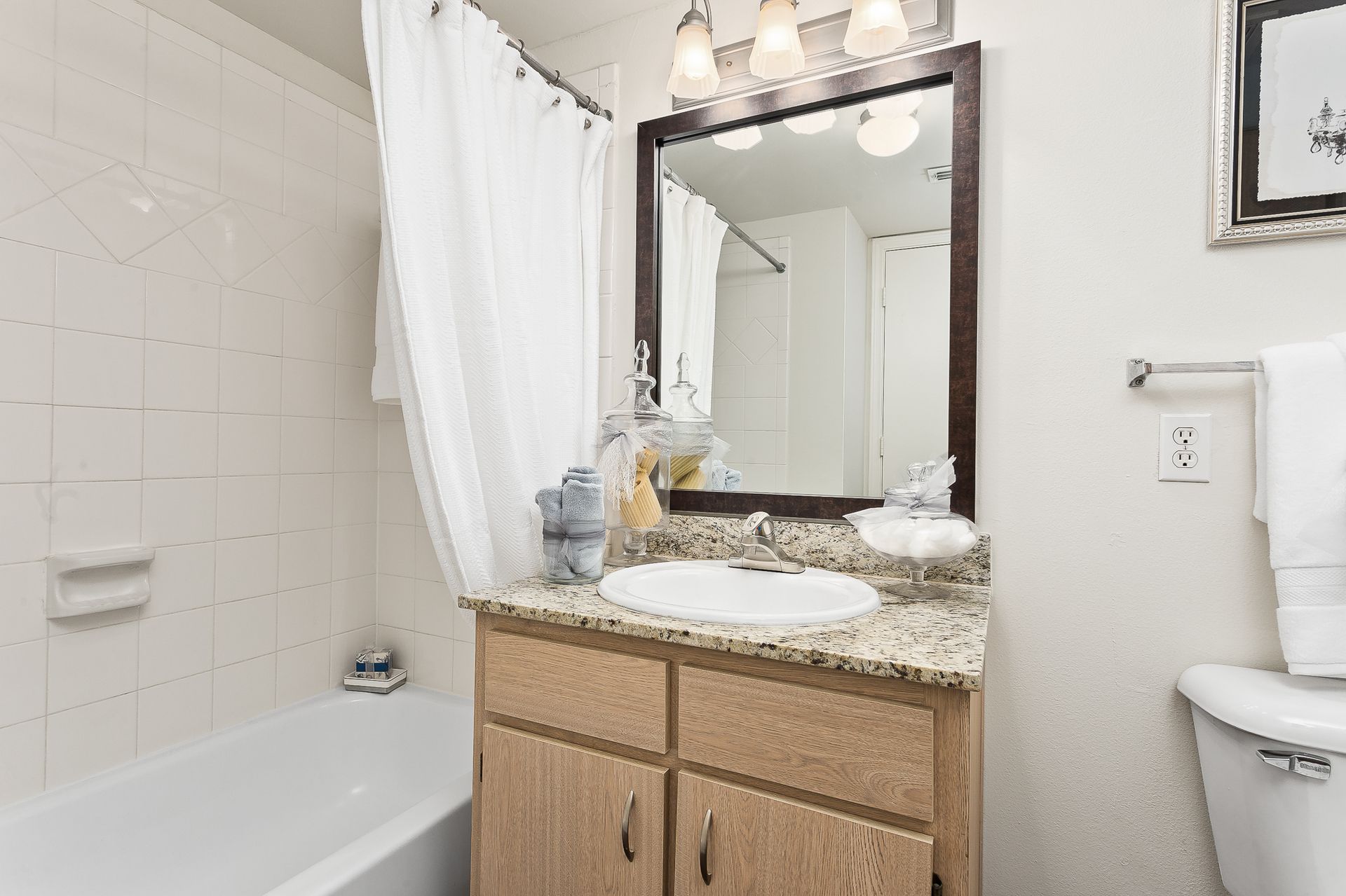 Bathroom with bath and shower combo and vanity