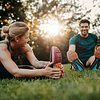 Man and woman stretching outside